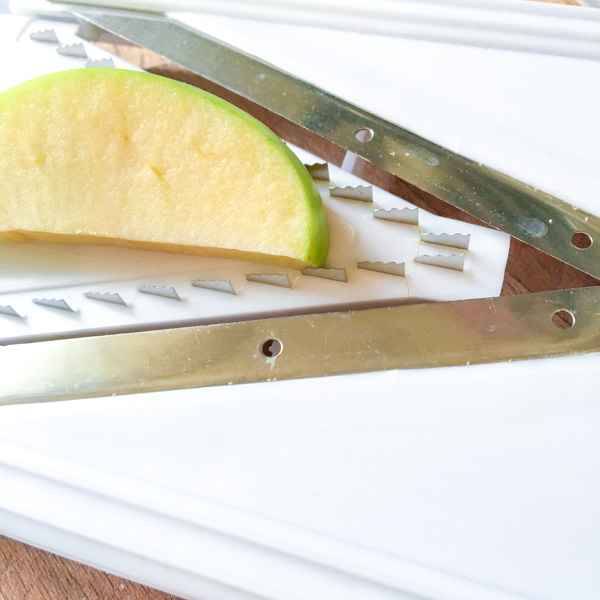 cutting aapples for a contemporary Waldorf Salad